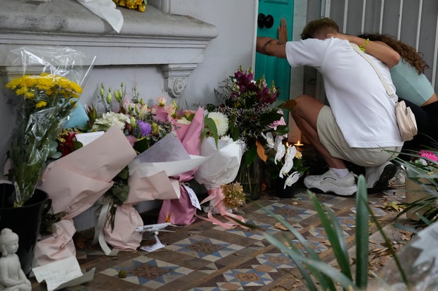 A couple embrace at the Paddington residence of Jesse Baird in Sydney, Tuesday, Feb. 27, 2024