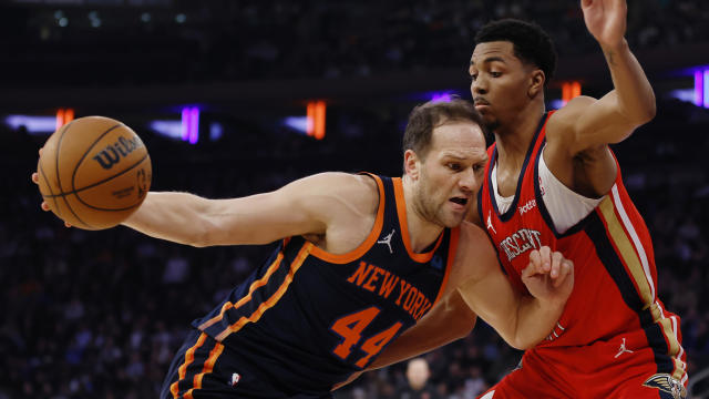 Bojan Bogdanovic #44 of the New York Knicks dribbles against Trey Murphy III #25 of the New Orleans Pelicans during the first half at Madison Square Garden on February 27, 2024 in New York City. 