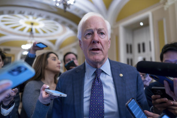 Sen. John Cornyn speaks to reporters at the Capitol on Wednesday, Feb. 7, 2024. 