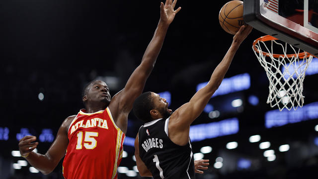 Mikal Bridges #1 of the Brooklyn Nets goes to the basket as Clint Capela #15 of the Atlanta Hawks defends during the first half at Barclays Center on March 02, 2024 in the Brooklyn borough of New York City. 