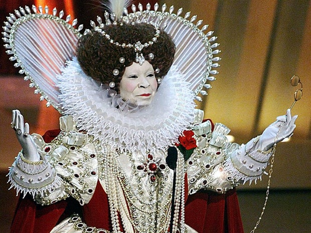 Whoopi Goldberg, dressed as Britain's Queen Elizabeth I, who was portrayed in "Elizabeth" and "Shakespeare in Love," opens the Academy Awards, March 21, 1999, at the Dorothy Chandler Pavilion in Los Angeles.