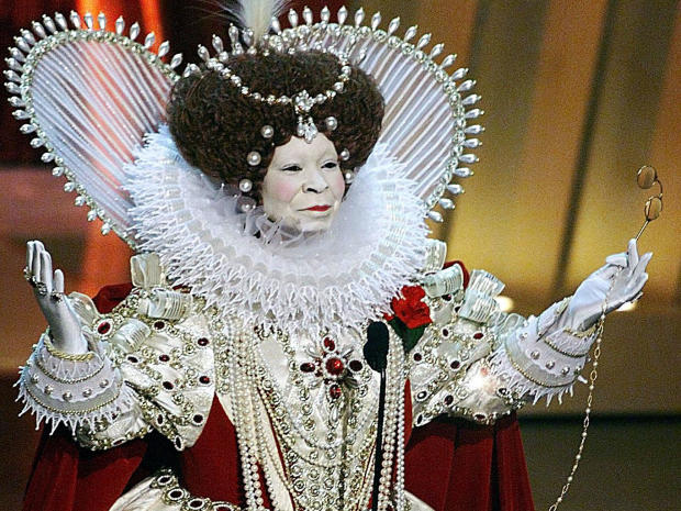 Whoopi Goldberg, dressed as Britain's Queen Elizabeth I, who was portrayed in "Elizabeth" and "Shakespeare in Love," opens the Academy Awards, March 21, 1999, at the Dorothy Chandler Pavilion in Los Angeles. 