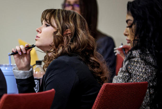 "Rust" film set armorer Hannah Gutierrez-Reed listens while expert witness Bryan Carpenter testifies during Gutierrez-Reed's involuntary manslaughter trial at the First Judicial District Courthouse in Santa Fe, New Mexico, Feb. 29, 2024. 