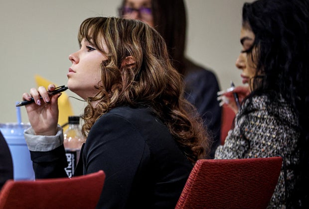 "Rust" film set armorer Hannah Gutierrez-Reed listens while expert witness Bryan Carpenter testifies during Gutierrez-Reed's involuntary manslaughter trial at the First Judicial District Courthouse in Santa Fe, New Mexico, Feb. 29, 2024.