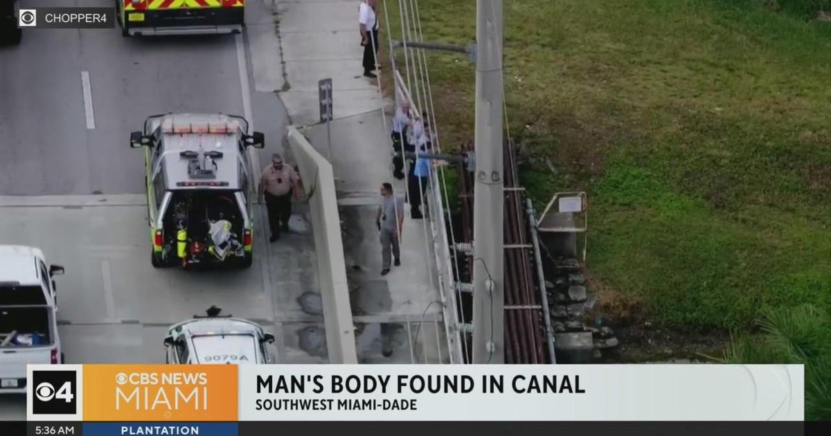 Man's body found in canal - CBS Miami