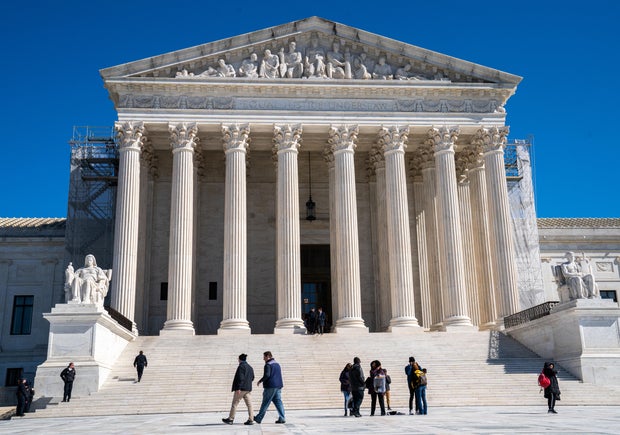 Pedestrians walk in front of the U.S. Supreme Court on Feb. 29, 2024, in Washington, D.C.