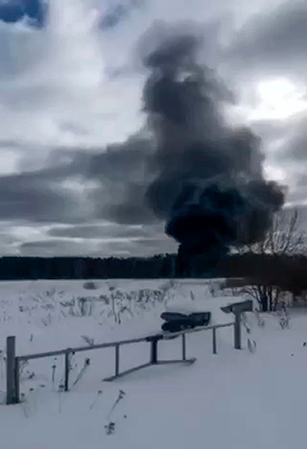 In this photo taken from video released by Ivanovo Novosti Telegram Channel on Tuesday, March 12, 2024, Smoke rises from a crashed Russian military Il-76 transport plane outside Ivanovo, Russia