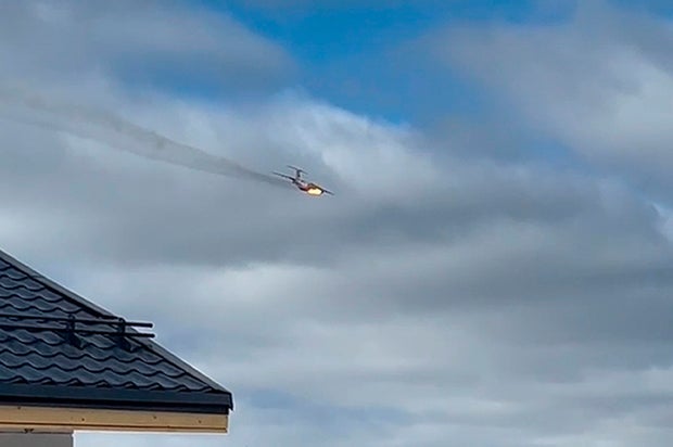 Russian military plane with 15 people on board crashes after engine catches fire during takeoff