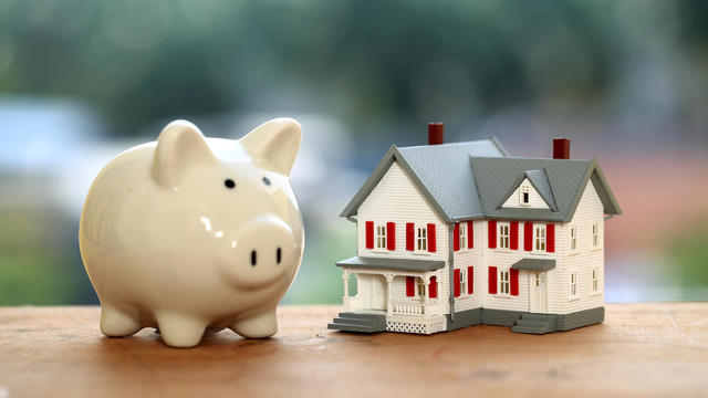 Piggy bank and miniature house,Close up 