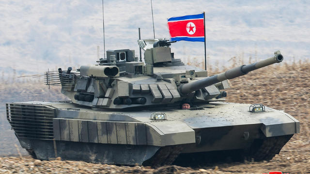 North Korean leader Kim Jong Un guides a military demonstration involving tank units 