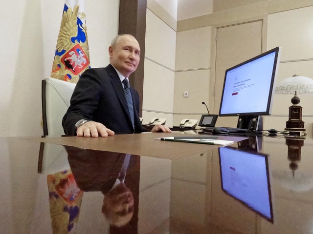 Russian President Vladimir Putin votes online in the presidential election in a residence outside Moscow
