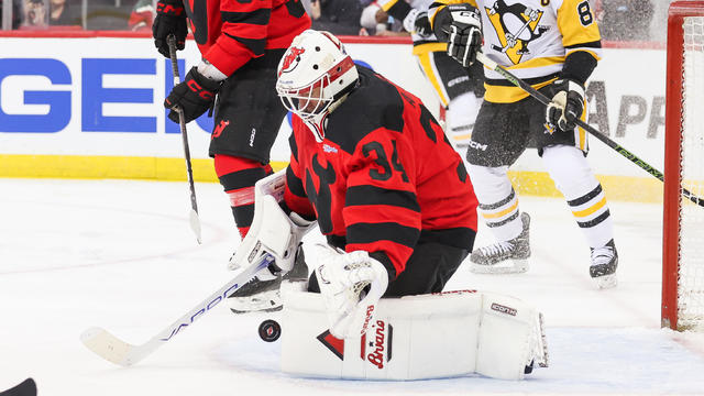 New Jersey Devils goaltender Jake Allen (34) makes a save during a game between the Pittsburgh Penguins and New Jersey Devils on March 19, 2024 at Prudential Center in the Newark, New Jersey. 