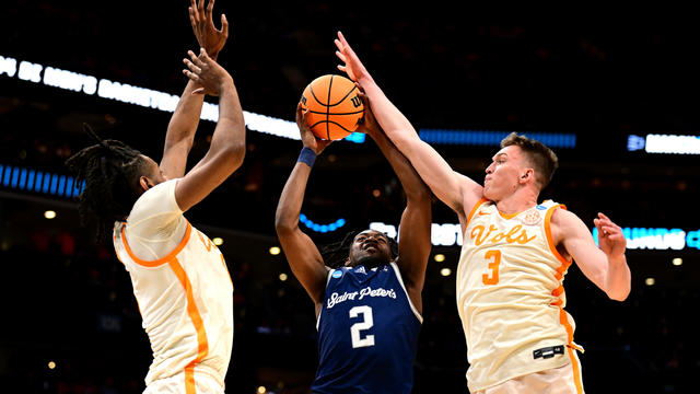 Dalton Knecht #3 of the Tennessee Volunteers defends a shot by Marcus Randolph #2 of the Saint Peter's Peacocks din the first half during the first round of the NCAA Men's Basketball Tournament at Spectrum Center on March 21, 2024 in Charlotte, North Caro 