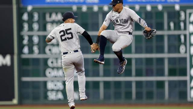 Gleyber Torres #25 and Juan Soto #22 of the New York Yankees celebrate a 5-4 win over the Houston Astros on Opening Day at Minute Maid Park on March 28, 2024 in Houston, Texas. 