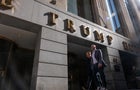 People walk by 40 Wall Street, a Trump-owned building in downtown Manhattan 