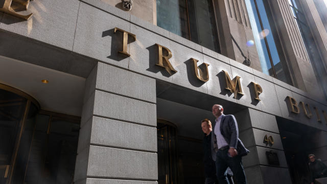 People walk by 40 Wall Street, a Trump-owned building in downtown Manhattan 