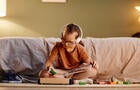 Girl with Down Syndrome Playing 