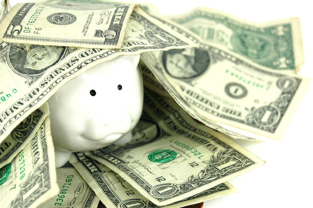 Smiley Piggy Bank and Dollar Bills 