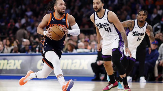 Jalen Brunson #11 of the New York Knicks drives to the basket as Trey Lyles #41 of the Sacramento Kings defends during the first half at Madison Square Garden on April 04, 2024 in New York City. 