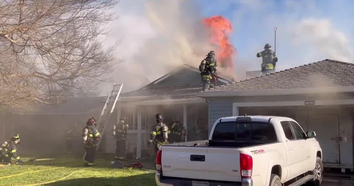 Raw video from Sacramento Fire shows flames through roof of Meadowview home