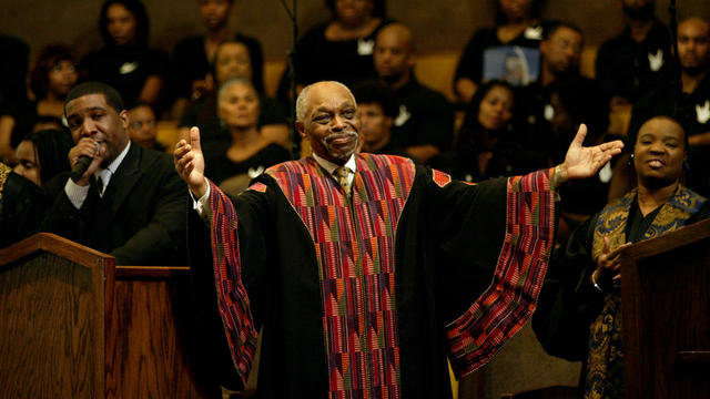 087251.ME.0912.chip Rev. Cecil Murray welcomes guests during the 8am service at the First African Me 