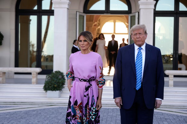 Republican presidential candidate, former President Donald Trump and former first lady Melania Trump arrive at the home of billionaire investor John Paulson on April 6, 2024 in Palm Beach, Florida.