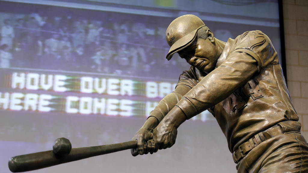 Hank Aaron memorialized with Hall of Fame statue and USPS stamp 50
years after hitting 715th home run