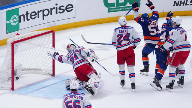 New York Islanders Center Bo Horvat (14) scores a goal on New York Rangers Goalie Igor Shesterkin (31) during the first period of the National Hockey League game between the New York Rangers and the New York Islanders on April 9, 2024, at UBS Arena in Elm 