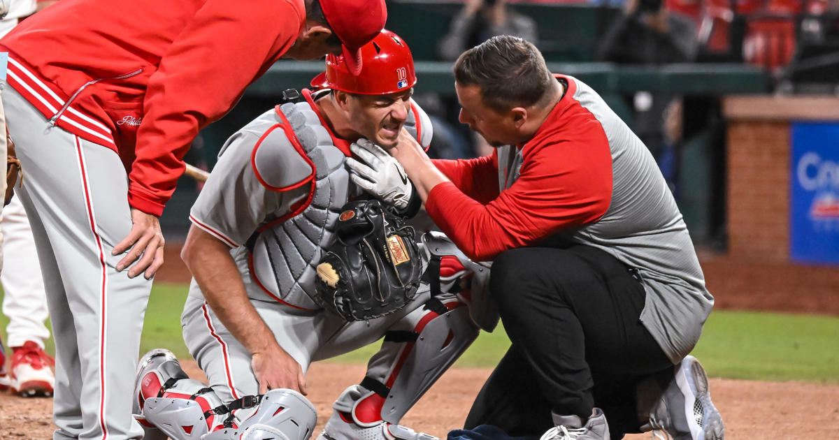 Philadelphia Phillies' J.T. Realmuto leaves loss to St. Louis Cardinals after taking pitch to his throat
