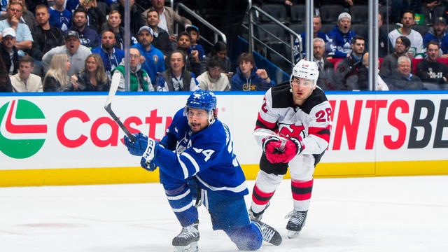 Auston Matthews #34 of the Toronto Maple Leafs shoots in front of Timo Meier #28 of the New Jersey Devils before scoring during the first period at Scotiabank Arena on April 11, 2024 in Toronto, Ontario, Canada. 
