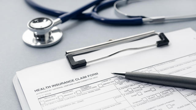 Health Insurance claim form on desk 