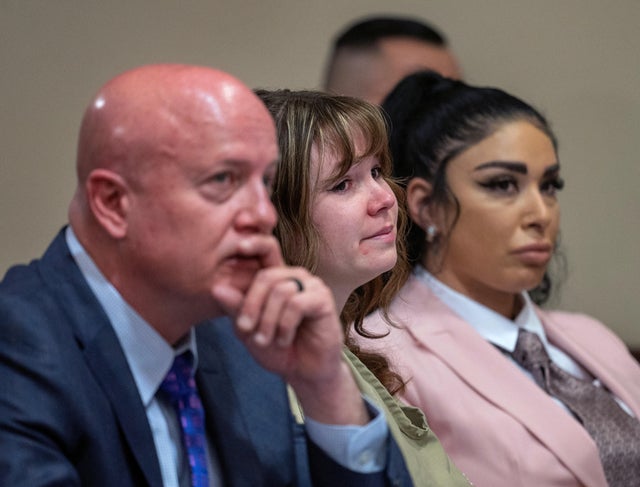 Hannah Gutierrez-Reed, who was the armorer for the movie "Rust," sits with her attorney Jason Bowles and paralegal Carmella Sisneros during her sentencing hearing at First District Court, in Santa Fe, New Mexico, April 15, 2024. 