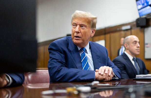Former President Donald Trump sits in the courtroom as he awaits the start of the second day of his criminal trial at Manhattan Criminal Court on April 16, 2024.