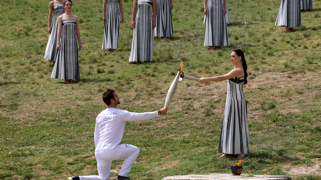 The 3,100-mile Olympic torch relay is underway. Here's what to know
about the symbolic tradition.