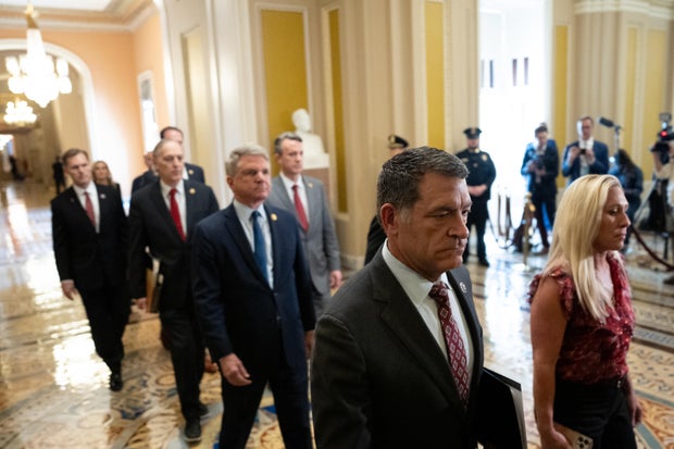 Reps. Marjorie Taylor Greene, Mark Green and other impeachment managers carry the articles of impeachment against Homeland Security Secretary Alejandro Mayorkas into the Senate Chamber on Capitol Hill on April 16, 2024.