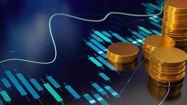 Economy Concept with a Stock Market Graphics and Coins 