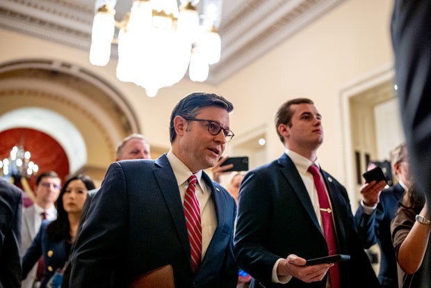 Speaker of the House Mike Johnson walks towards the House chamber at the Capitol on April 19, 2024.