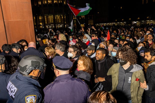 NYPD officers detain protesters at New York University