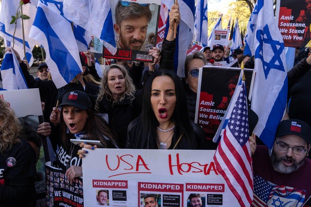 People hold signs and Israeli and American flags at a pro-Israel rally held in support of hostages taken on Oct. 7, 2023, outside of Columbia University on April 26, 2024, in New York City.