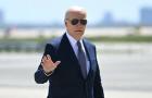 President Biden waves as he walks to board Air Force One at John F. Kennedy International Airport in New York on April 26, 2024. 