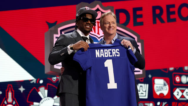 Malik Nabers poses with NFL Commissioner Roger Goodell after being selected sixth overall by the New York Giants during the first round of the 2024 NFL Draft at Campus Martius Park and Hart Plaza on April 25, 2024 in Detroit, Michigan. 