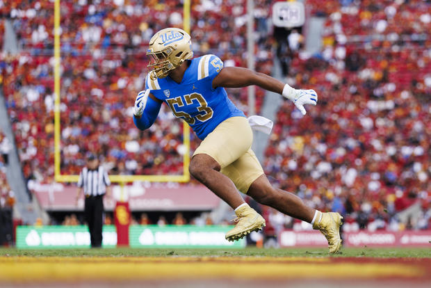 Darius Muasau #53 of the UCLA Bruins rushes the edge during a game against the USC Trojans at United Airlines Field at the Los Angeles Memorial Coliseum on November 18, 2023 in Los Angeles, California. 