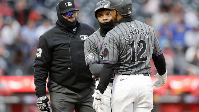 New York Mets first base coach Antoan Richardson #66 gets in between Francisco Lindor #12 and first base umpire Laz Diaz after Lindor was called out during the eighth inning against the St. Louis Cardinals at Citi Field on April 27, 2024 in New York City. 