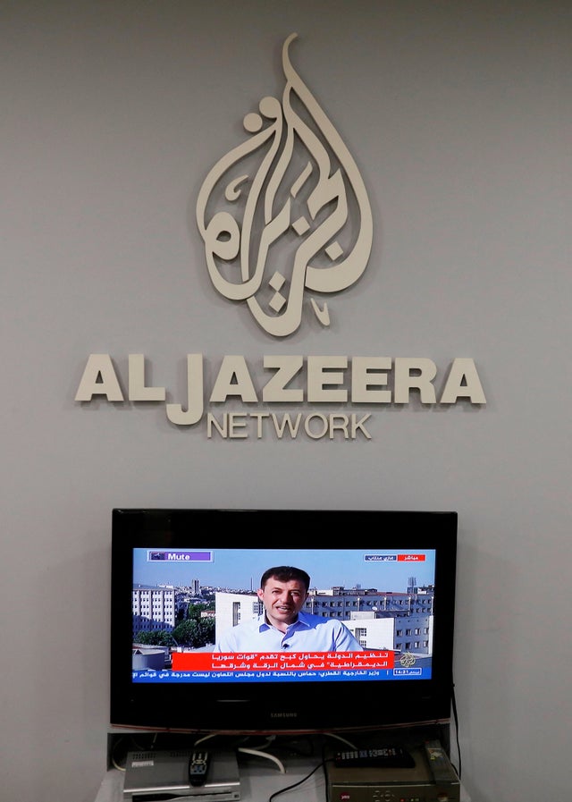 FILE PHOTO: The logo of Qatar-based Al-Jazeera network is seen in one of their offices in Jerusalem 