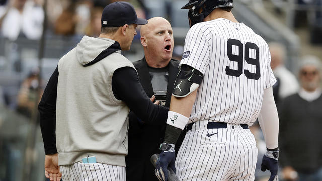Aaron Judge #99 and manager Aaron Boone #17 of the New York Yankees argue with home plate umpire Ryan Blakney after Judge was ejected during the seventh inning against the Detroit Tigers at Yankee Stadium on May 04, 2024 in New York City. 