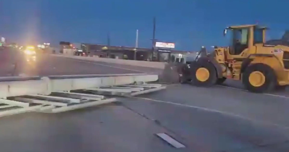 I-25 reopens north of Denver after strong winds knock down signpost ...