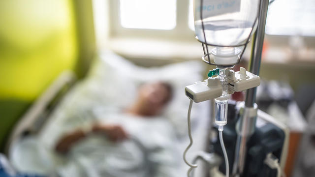 Drip infusion of a patient in a hospital room. 