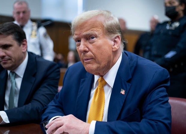 Former President Donald Trump sits next to his lawyer Todd Blanche as he arrives for his trial at Manhattan Criminal Court on May 14, 2024.