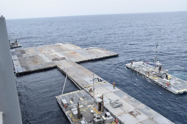 A photo released by the Pentagon shows the construction of the floating pier that will be used to transport humanitarian aid to Gaza on April 26, 2024. 