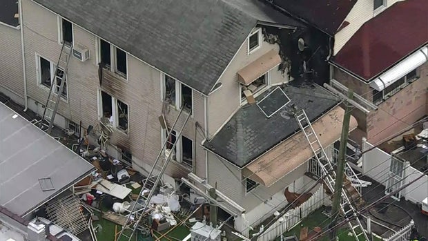 An aerial view of a home in the Bronx that appears to have significant fire damage.